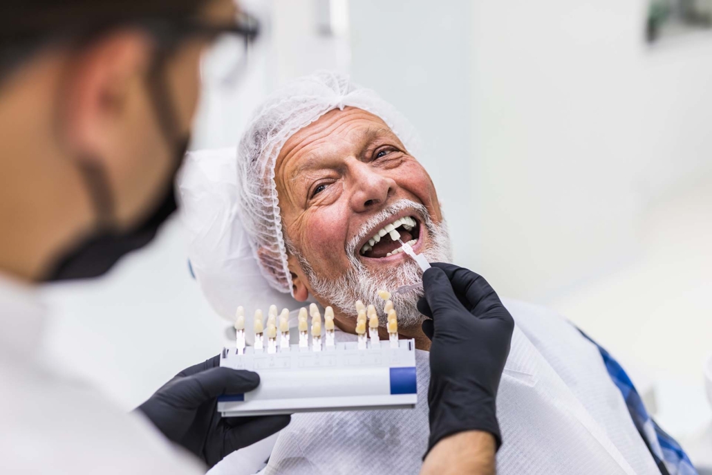 Senior man having dental treatment at dentist's office.