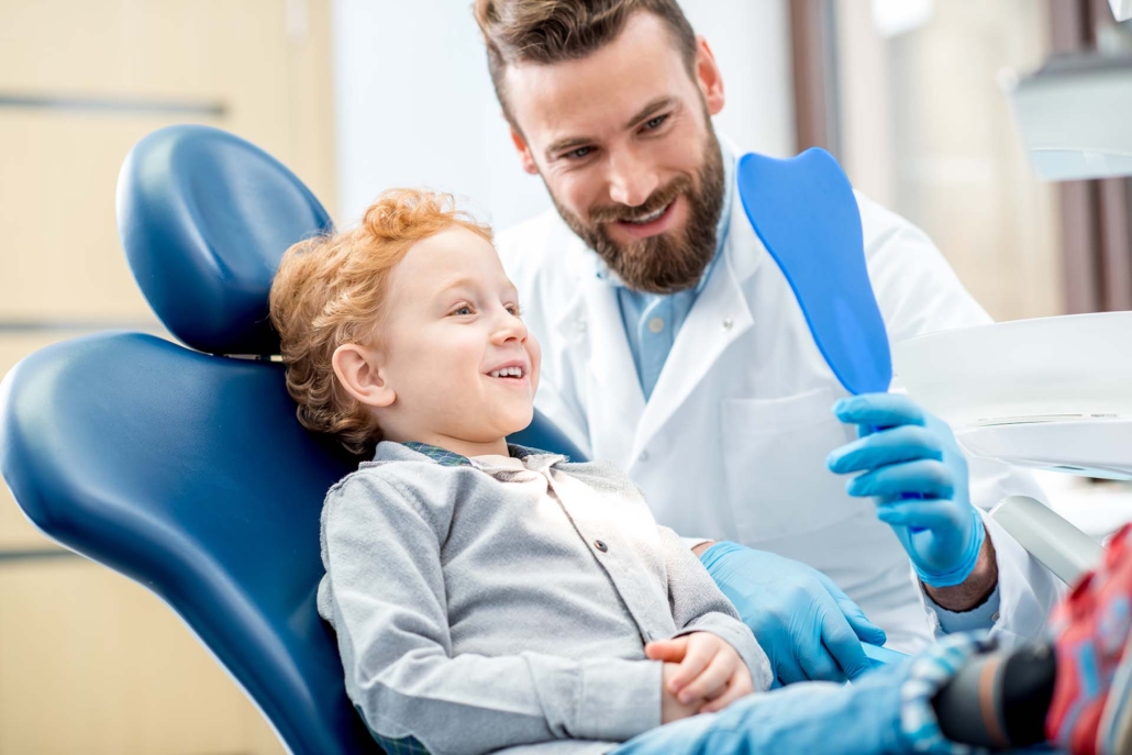 Boy with dentist at the dental office
